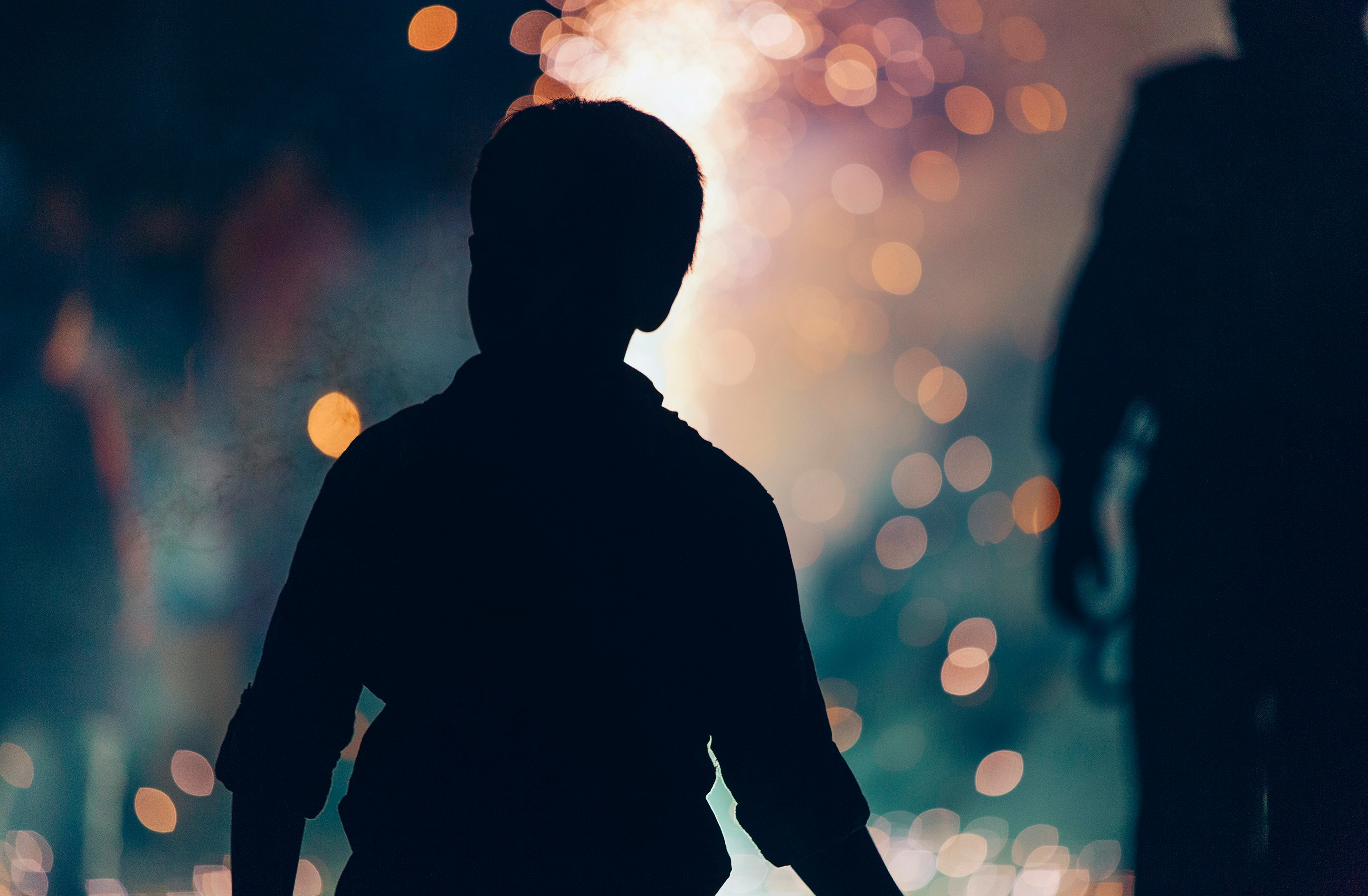 silhouette photography of boy beside woman